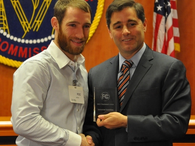 Representative from Amara.org receiving The Chairman's Awards for Advancement in Accessibility from FCC